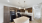 Apartment kitchen with brown cabinets and granite countertops