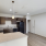 Kitchen with brown cabinets and black appliances