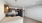 Kitchen with brown cabinets and black appliances