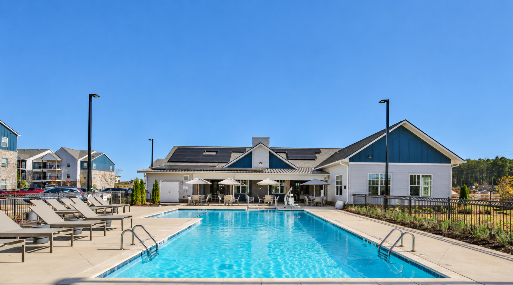 Swimming pool and sundeck and building in the background