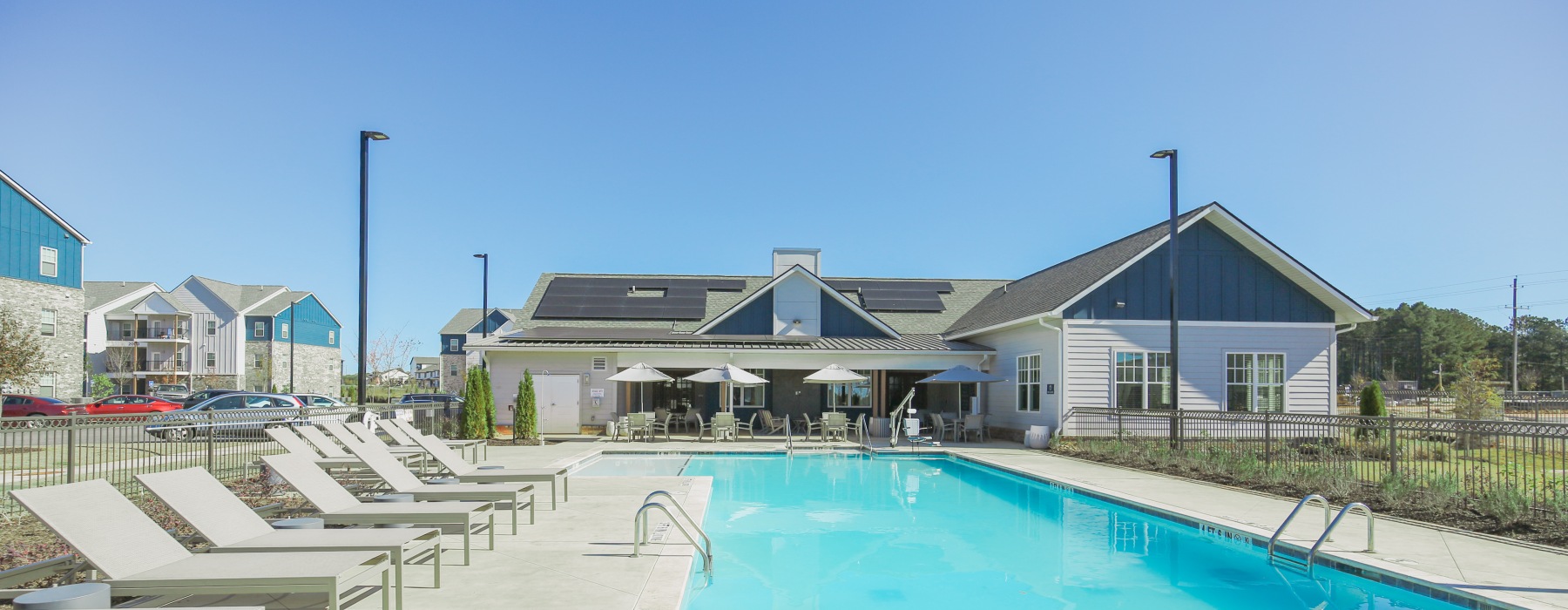 Swimming pool and sundeck and building in the background