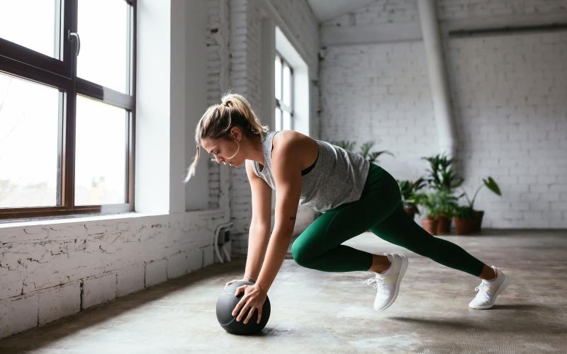 a person working out with a ball